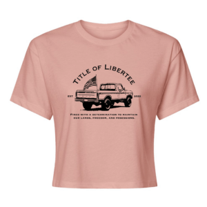 Women’s Desert Pink crop top with bold patriotic Backroad Defender design in white ink. Loose-fit, 60% cotton / 40% polyester blend for soft, breathable comfort.